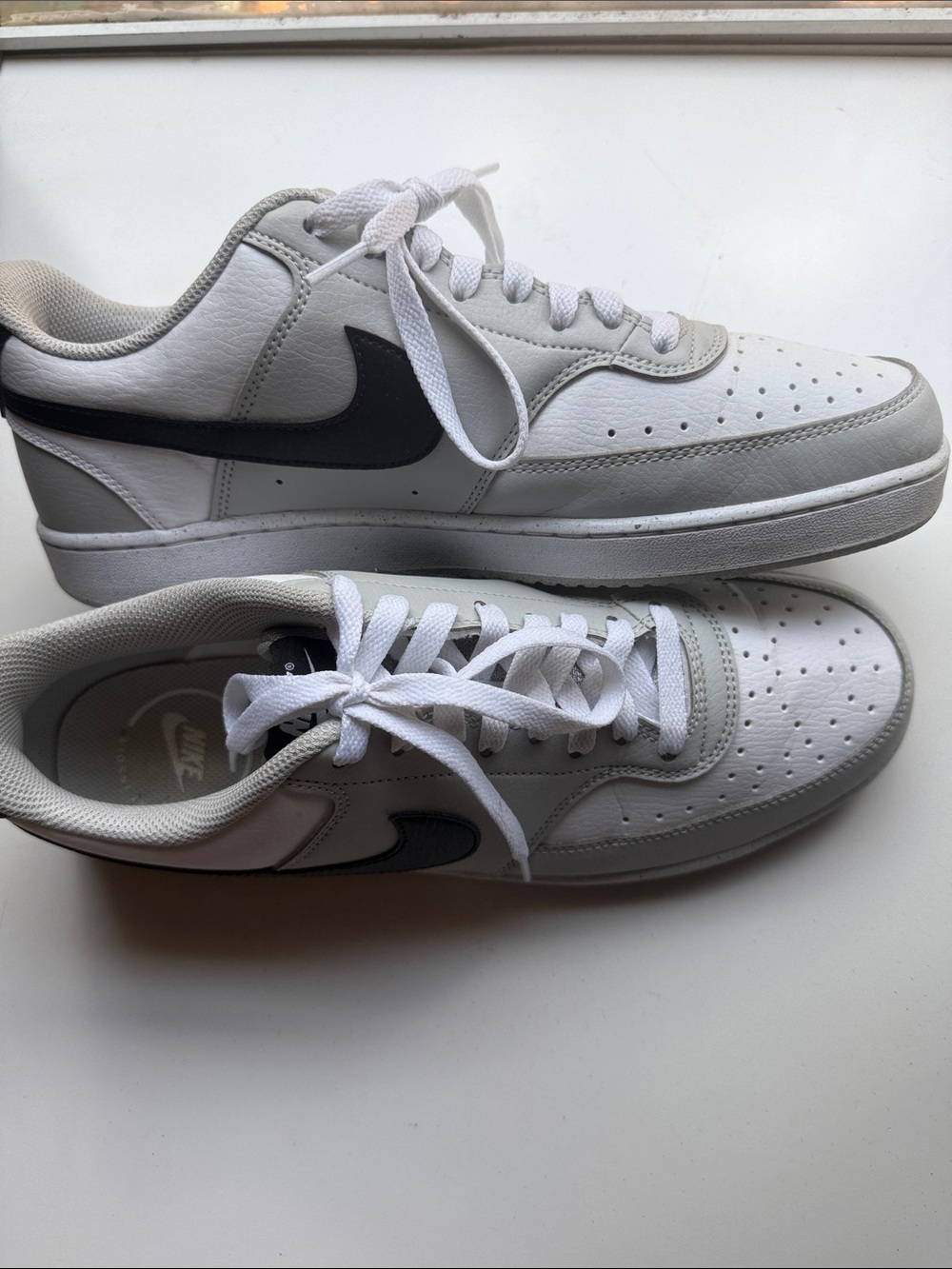 Nike Men's White Leather Sneakers with Black Swoosh Accent